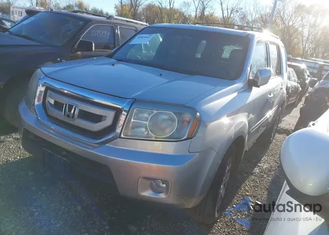 2011 Honda Pilot Touring z USA, uszkodzony, nr VIN 5FNYF4H94BB090771